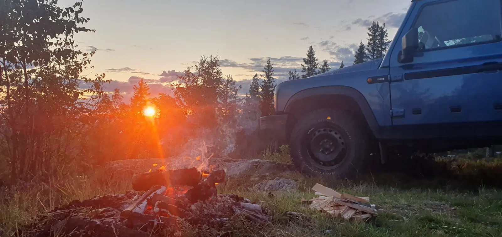Campfire next to the Grenadier at sunset