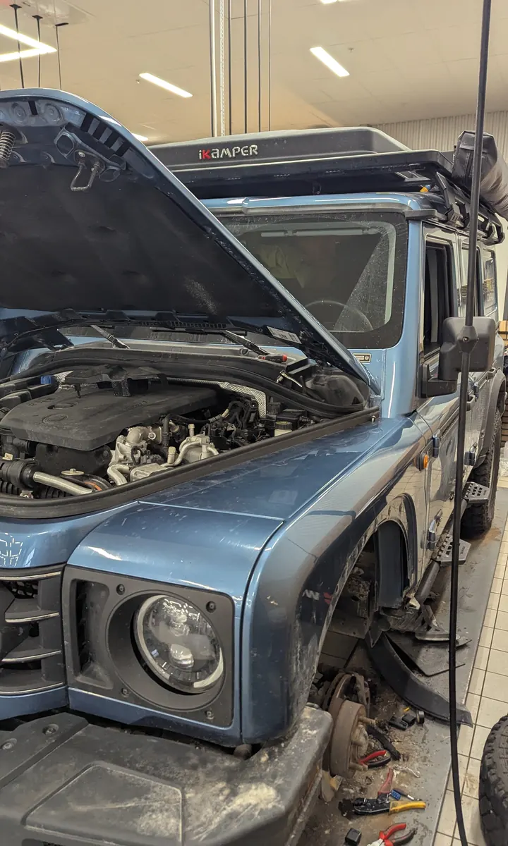 The Grenadier in for service with the bonnet open