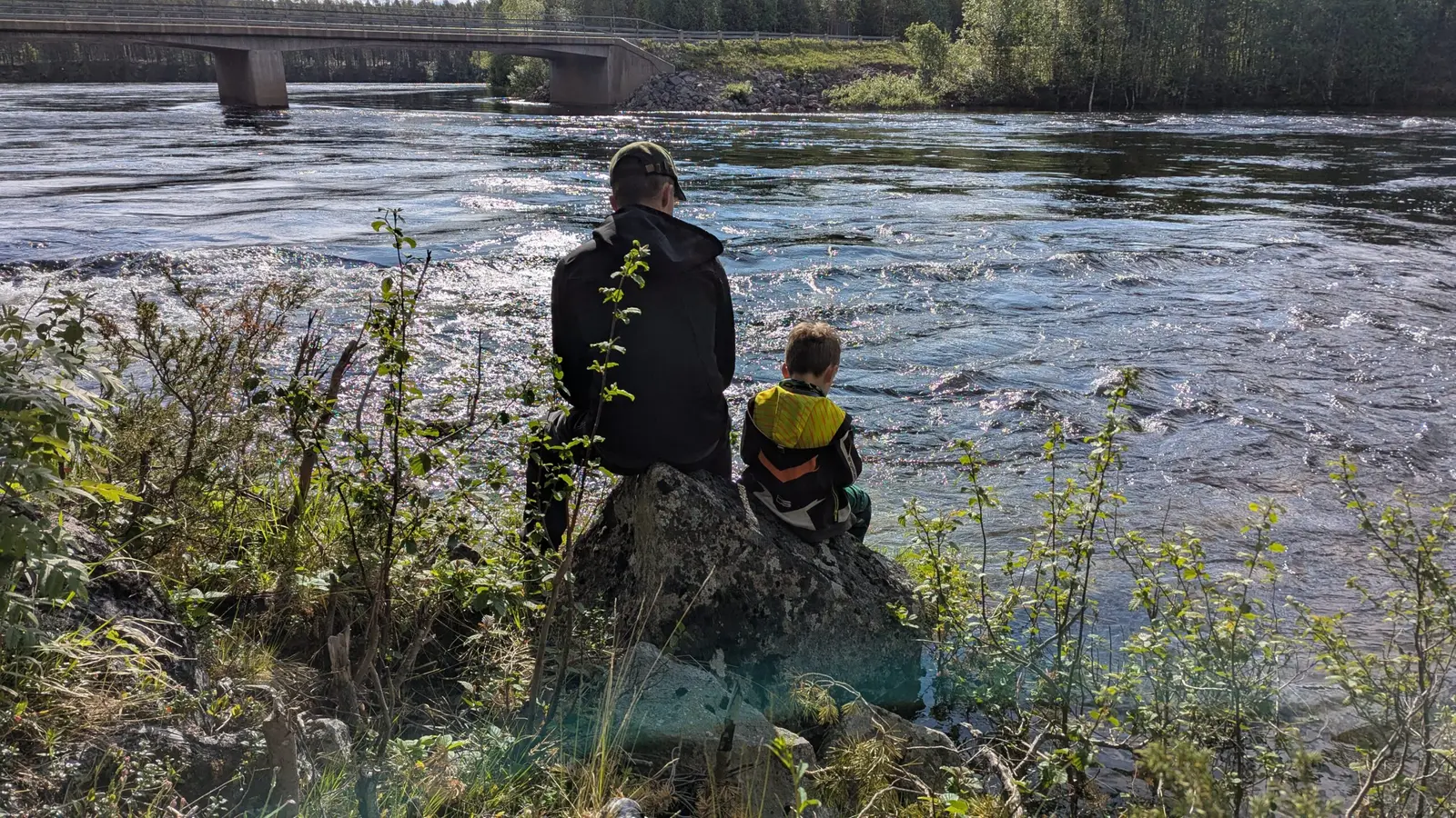 A family by a river in the forest