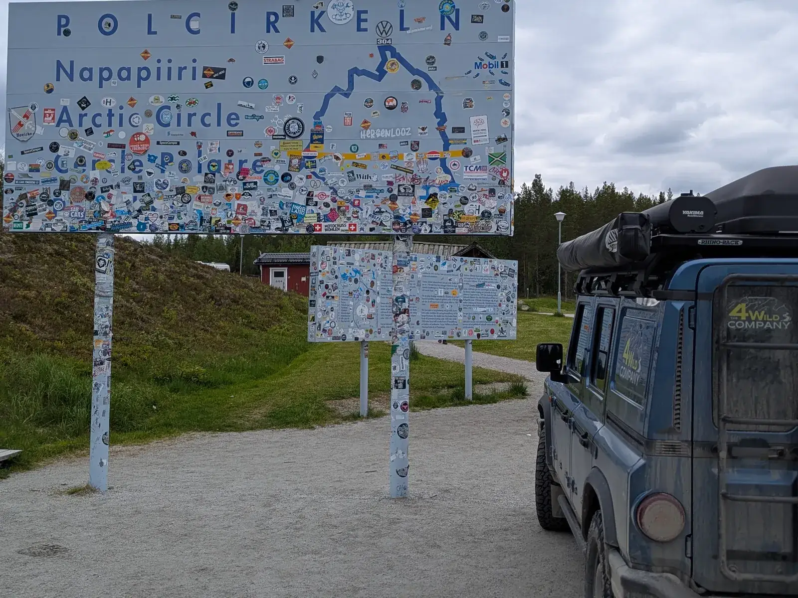 Our Grenadier at the Arctic Circle sign