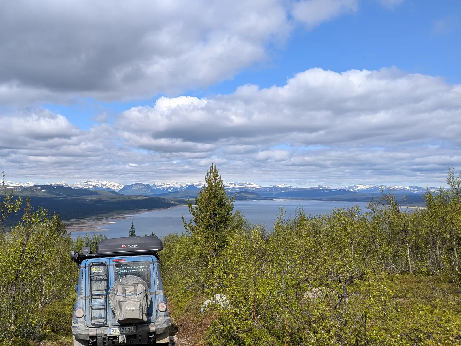 Our 4×4 on a fjell track above a lake in Norway