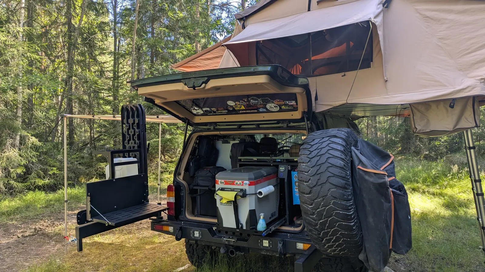 Kitchen and fridge in the back of the Jeep