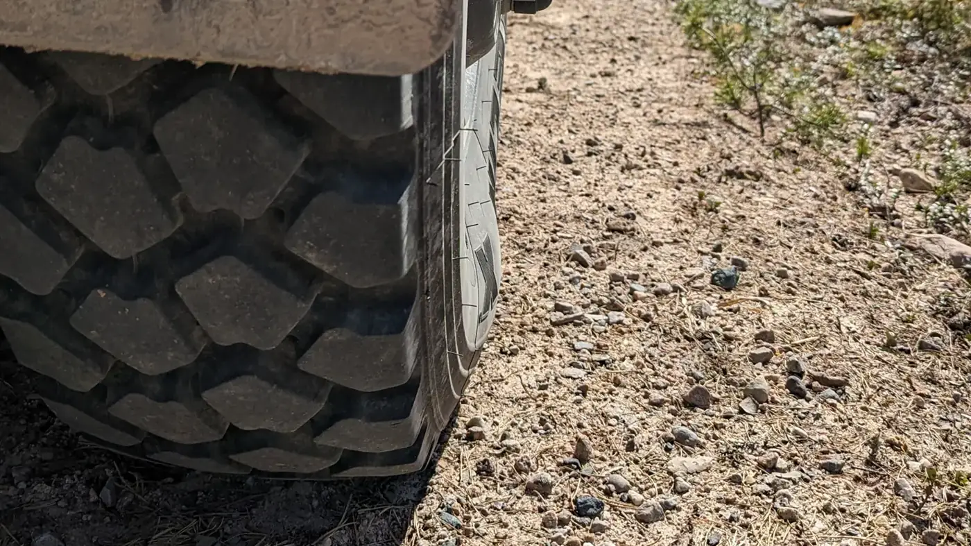 All-terrain tyre on a dry forest track