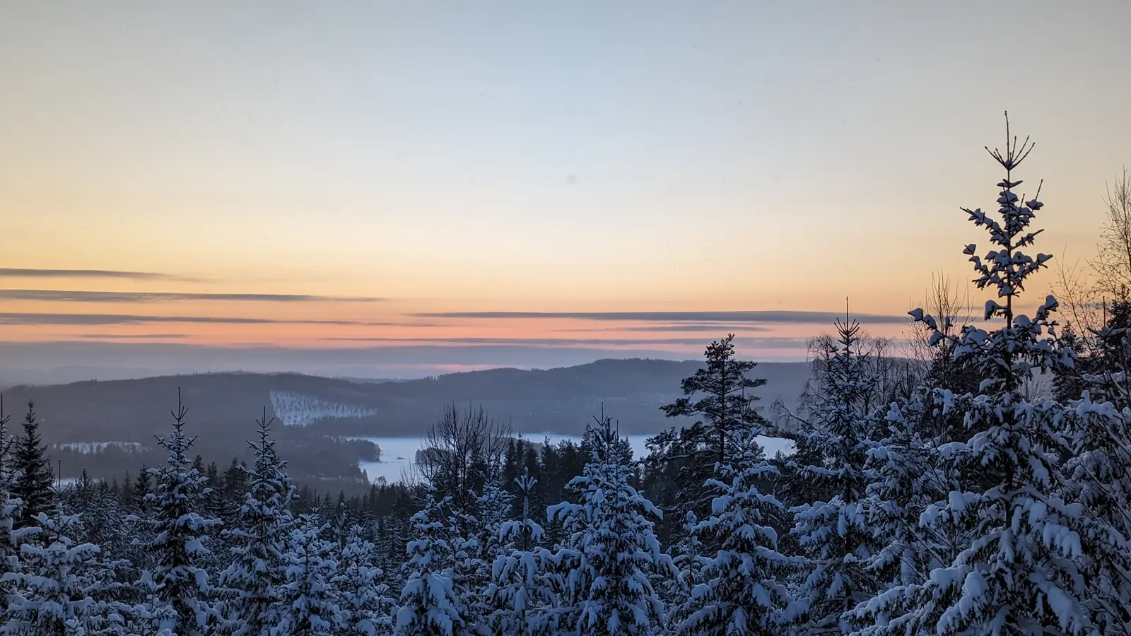 Sunset over snowy hills