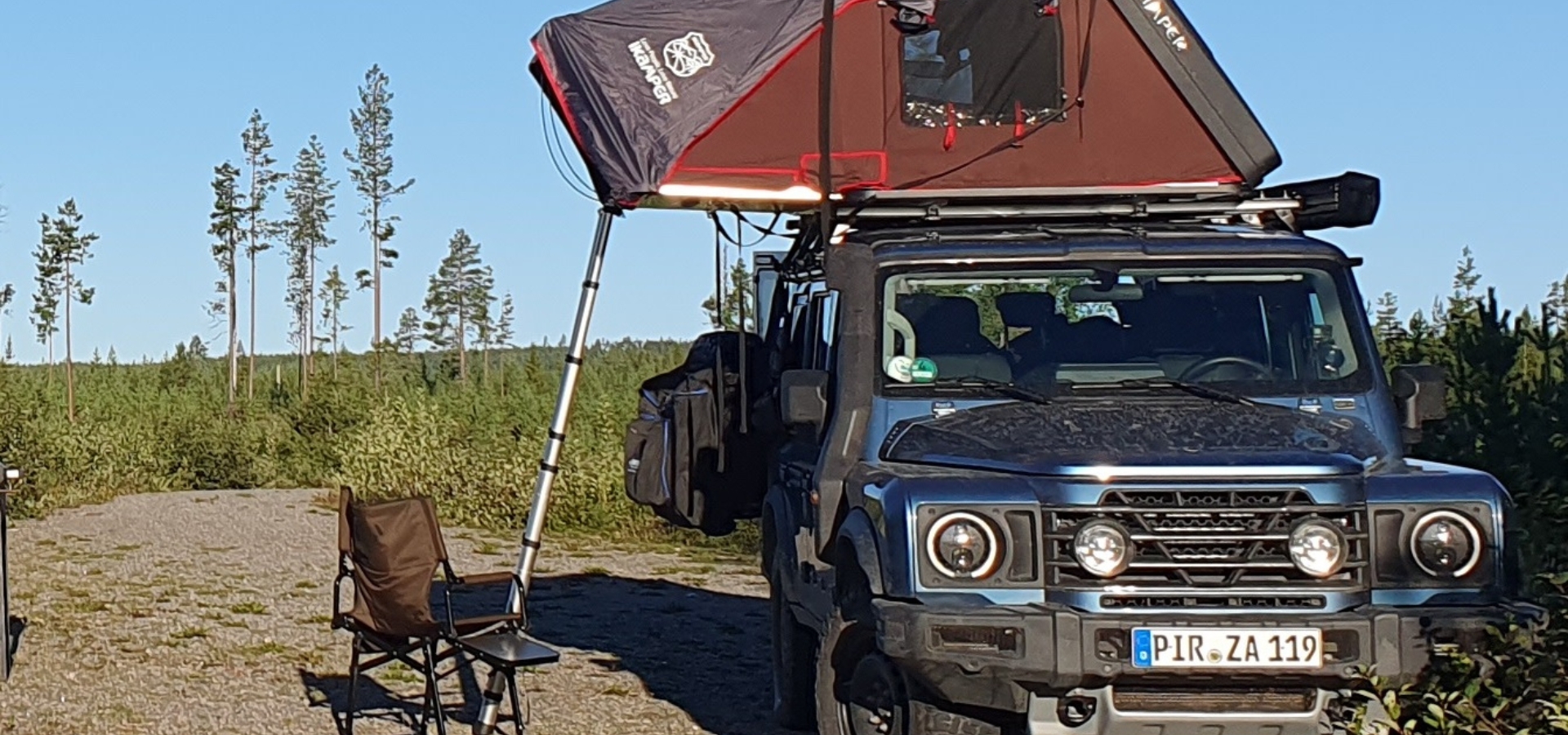 Grenadier jeep 4x4 with ikamper rooftop tent camping offroad in nature in Sweden