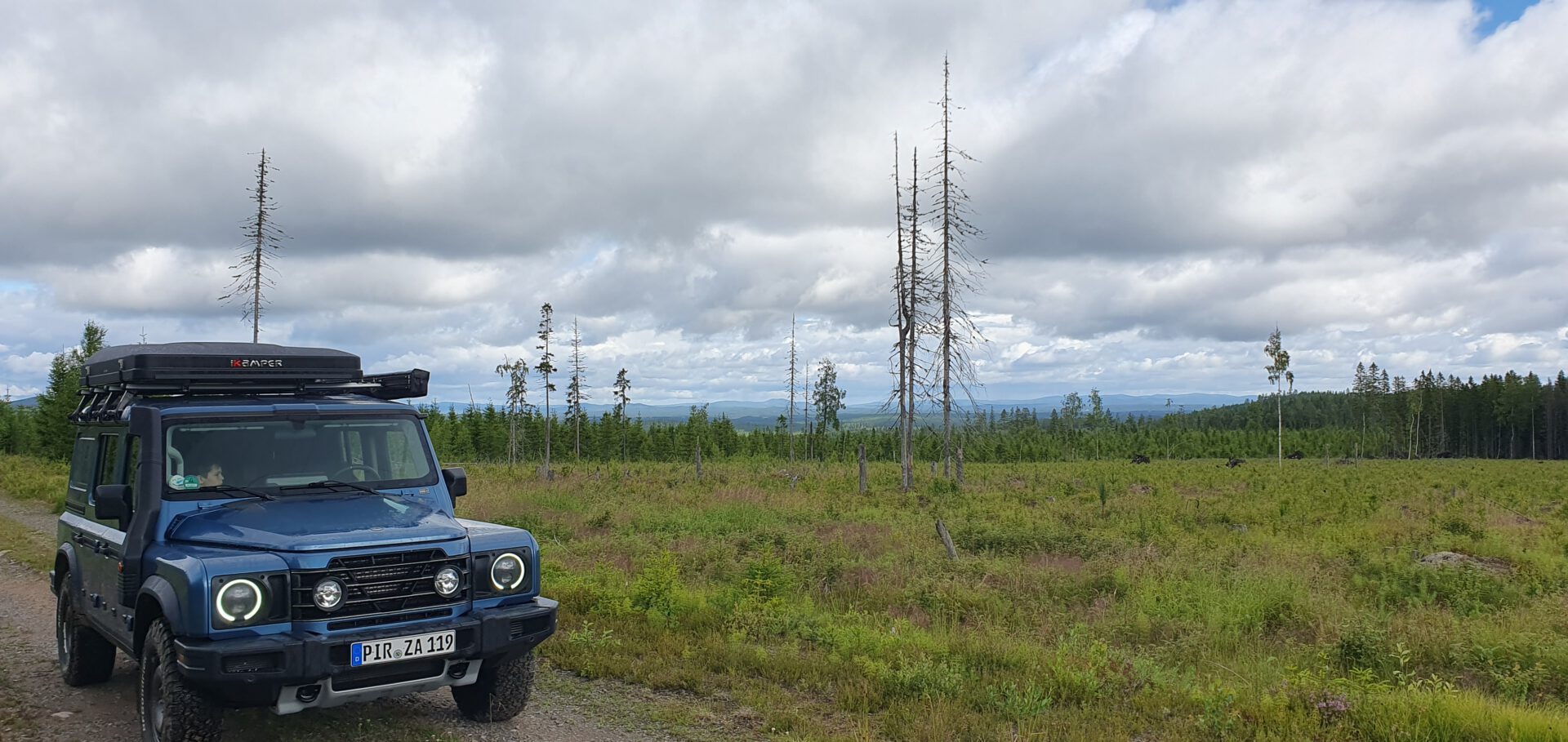 Grenadier jeep with ikamper rooftop tent in nature of Sweden